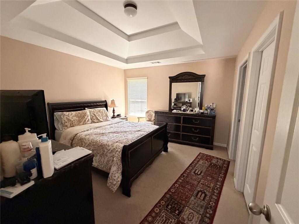 4080 Kittery Point Southwest Snellville, GA 30039 - Photo 13 of 25 a bedroom with a bed and a dresser