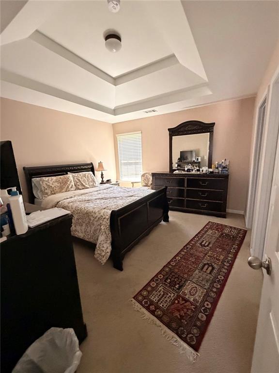 4080 Kittery Point Southwest Snellville, GA 30039 - Photo 14 of 25 a bed room with a bed window and dresser