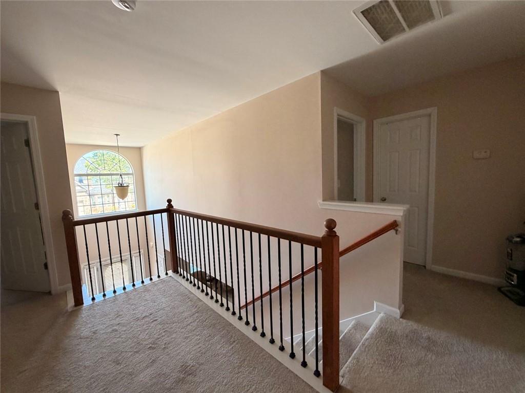 4080 Kittery Point Southwest Snellville, GA 30039 - Photo 2 of 25 a view of a hallway with windows
