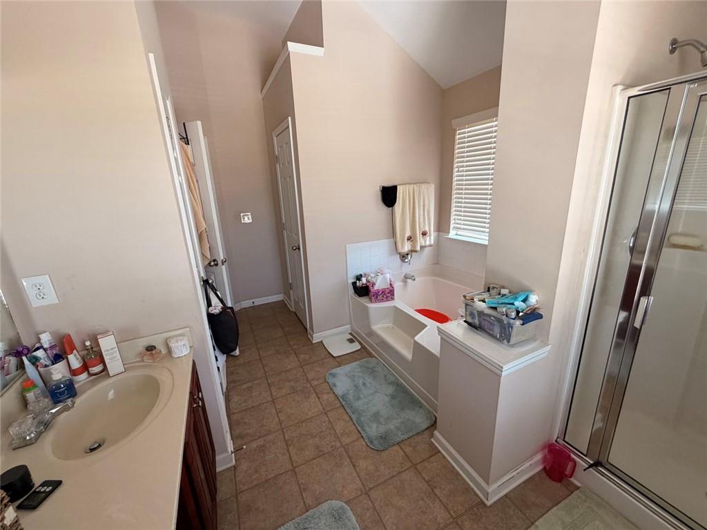 4080 Kittery Point Southwest Snellville, GA 30039 - Photo 4 of 25 a room with a sink washer and dryer
