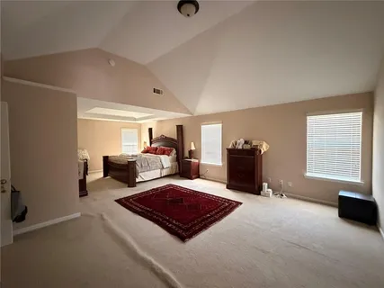 a living room with furniture rug and window