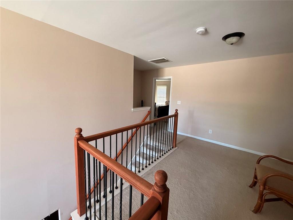 4080 Kittery Point Southwest Snellville, GA 30039 - Photo 7 of 25 a view of staircase with railing and white walls