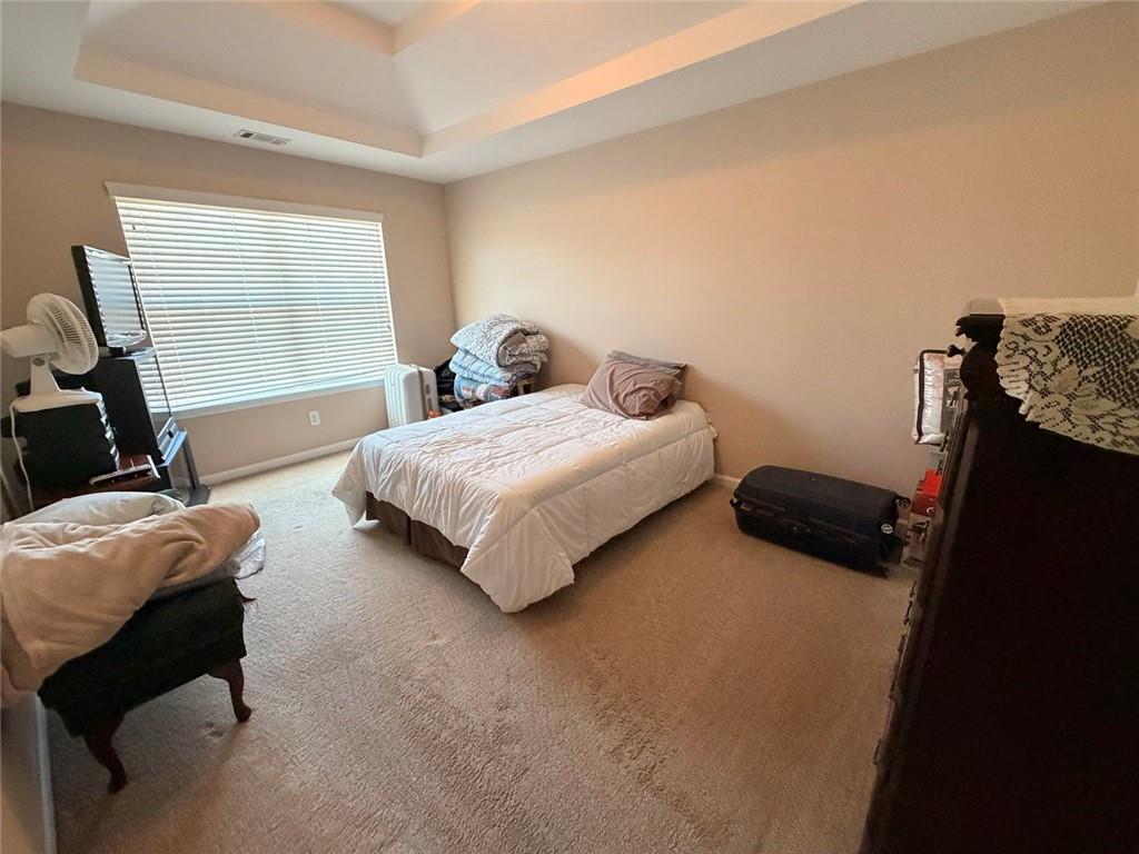 4080 Kittery Point Southwest Snellville, GA 30039 - Photo 10 of 25 a bedroom with bed and a window