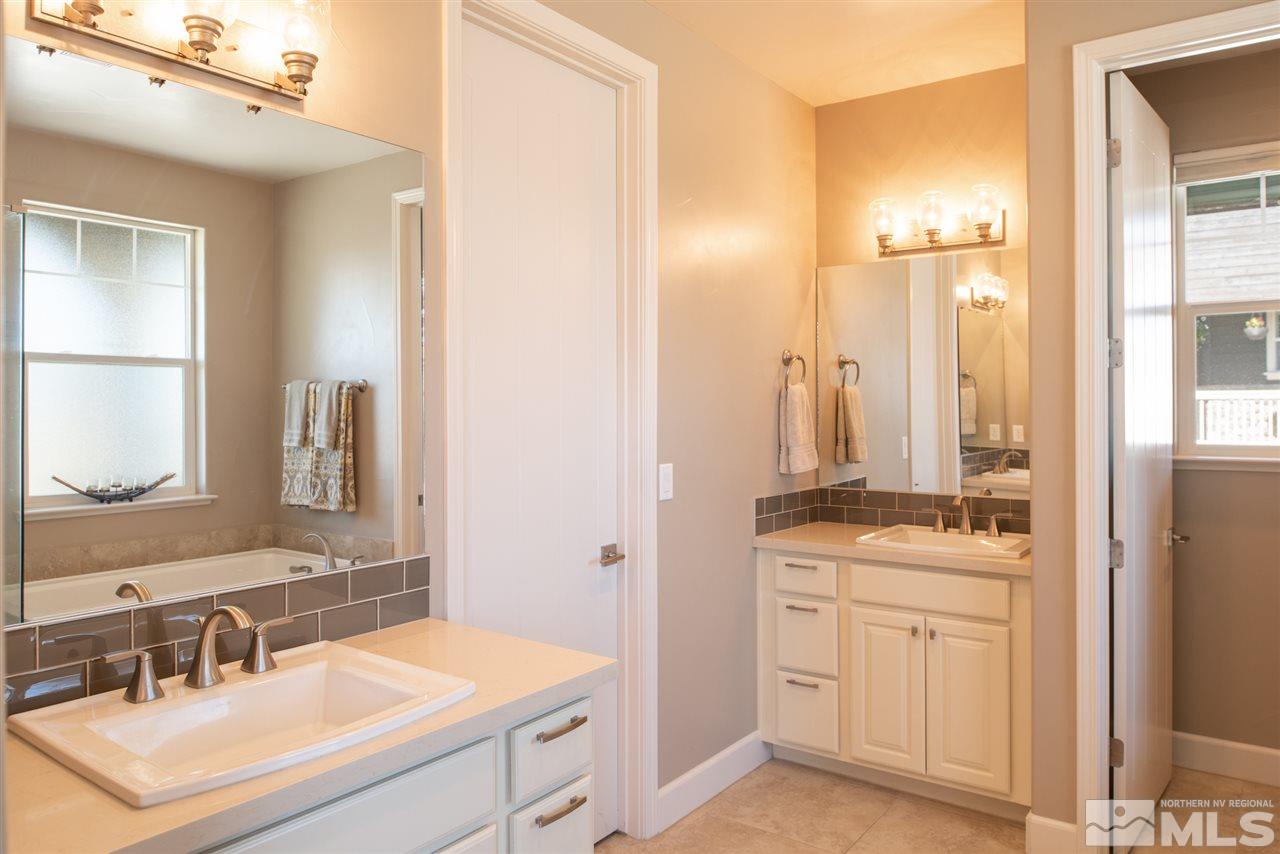 330 Mt Rose Street Reno, NV 89509 - Photo 17 of 32 a bathroom with a sink vanity toilet and a mirror
