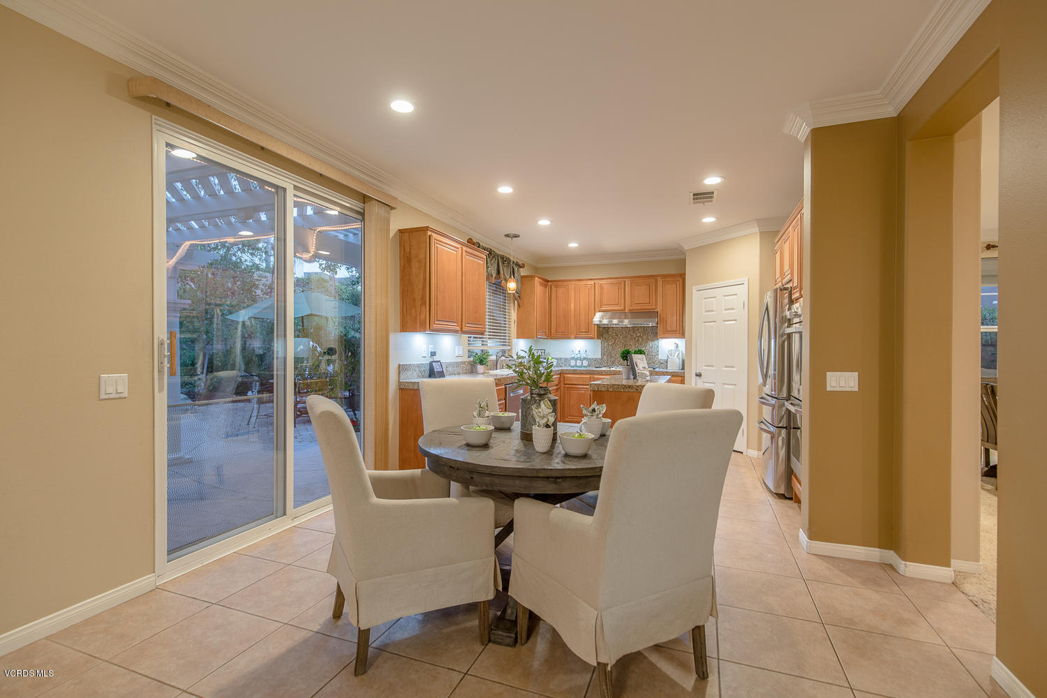 14410 Peach Hill Road Moorpark, CA 93021 - Photo 19 of 45 a dining room with furniture and a floor to ceiling window