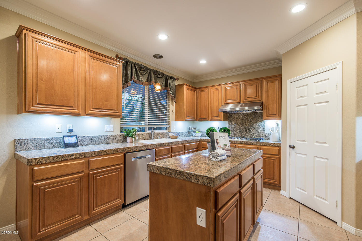 14410 Peach Hill Road Moorpark, CA 93021 - Photo 21 of 45 a kitchen with a sink stove and cabinets