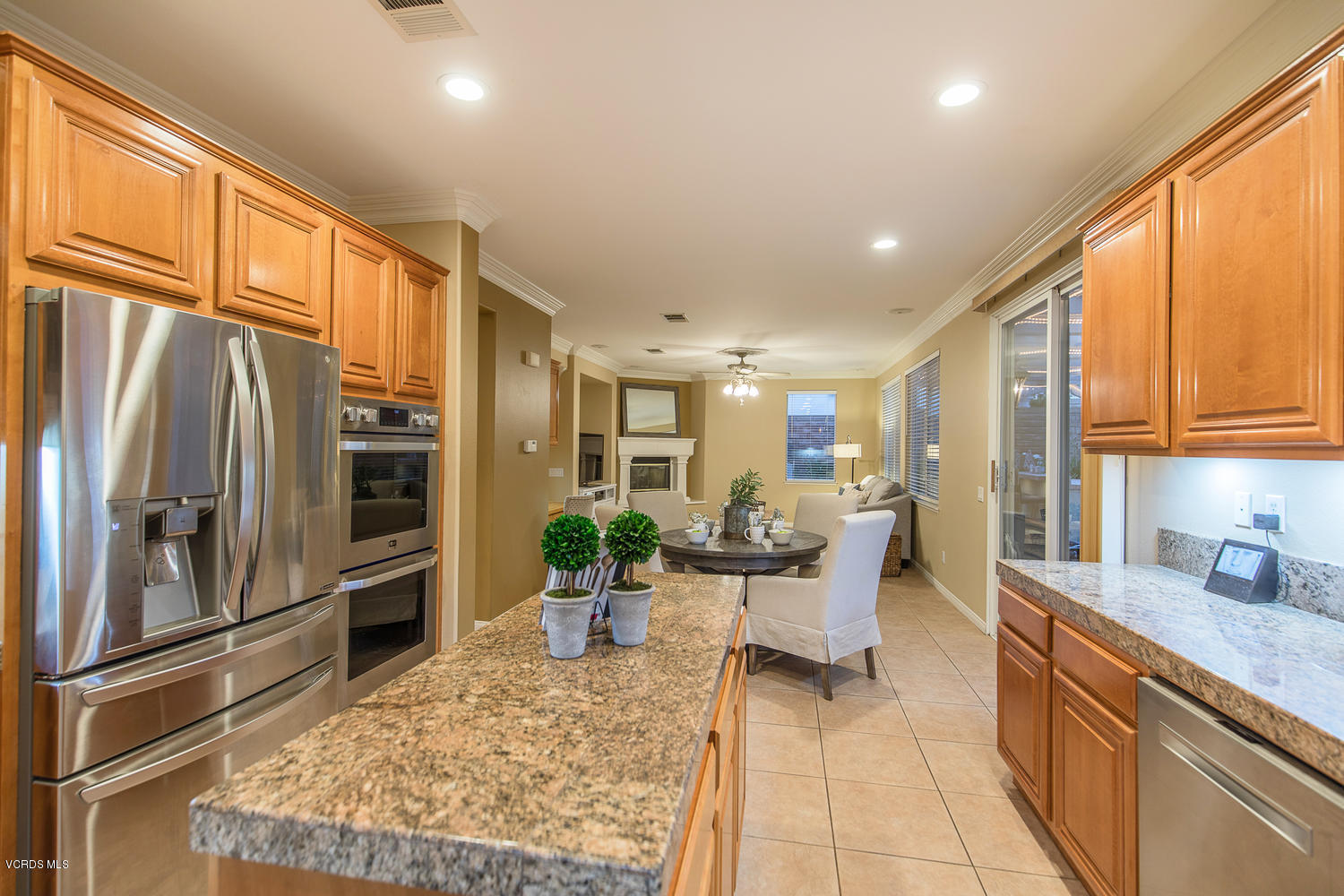 14410 Peach Hill Road Moorpark, CA 93021 - Photo 23 of 45 a kitchen with stainless steel appliances granite countertop sink refrigerator and microwave