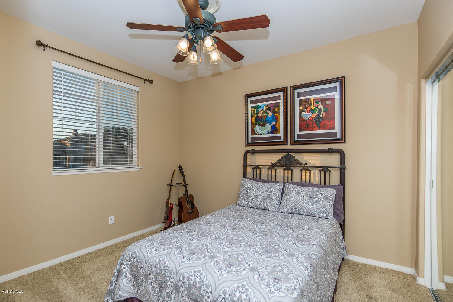 14410 Peach Hill Road Moorpark, CA 93021 - Photo 28 of 45 a bedroom with a bed and a chandelier