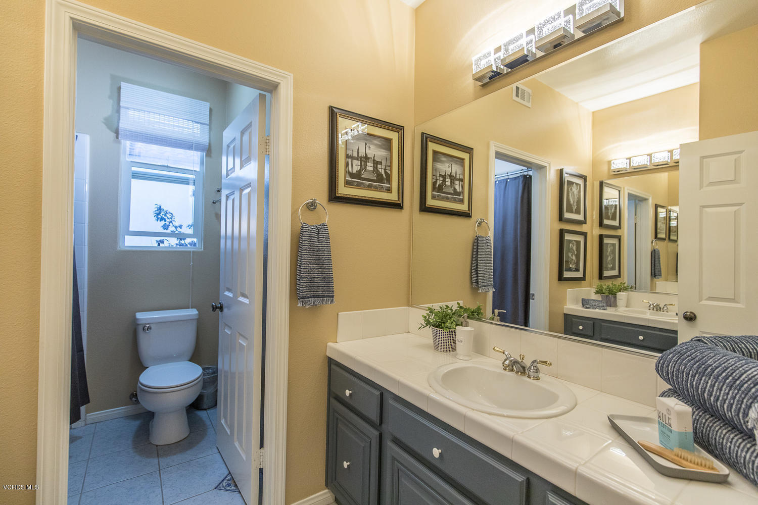 14410 Peach Hill Road Moorpark, CA 93021 - Photo 31 of 45 a spacious bathroom with a granite countertop sink toilet and shower