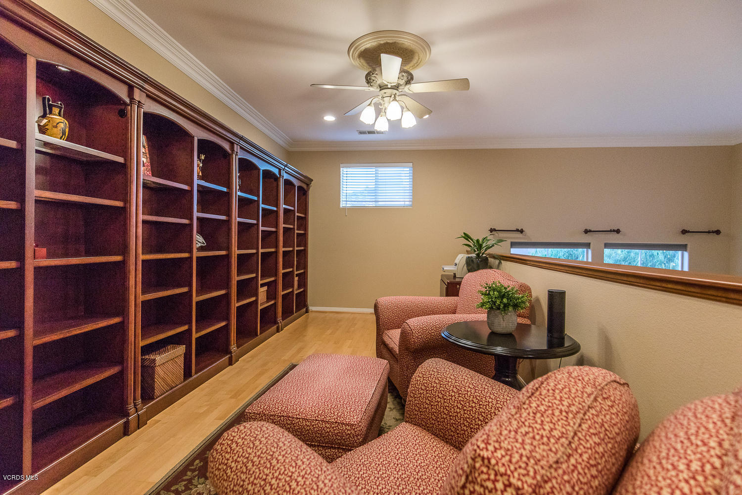 14410 Peach Hill Road Moorpark, CA 93021 - Photo 34 of 45 a bedroom with furniture and a chandelier