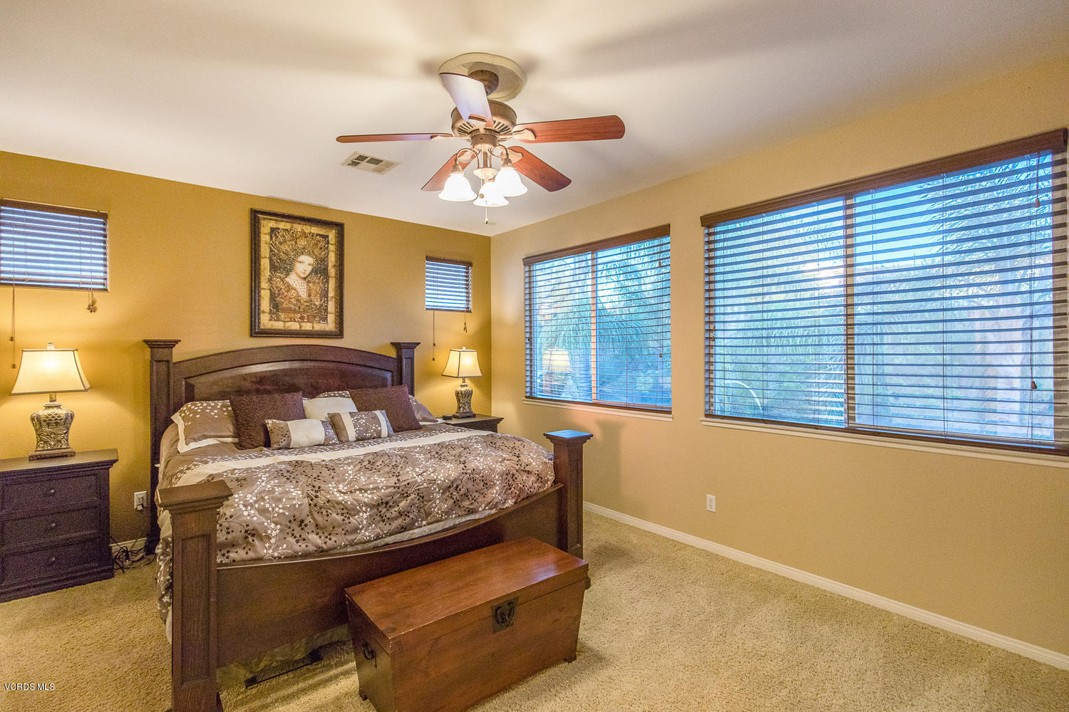 14410 Peach Hill Road Moorpark, CA 93021 - Photo 35 of 45 a bedroom with a bed and a chandelier