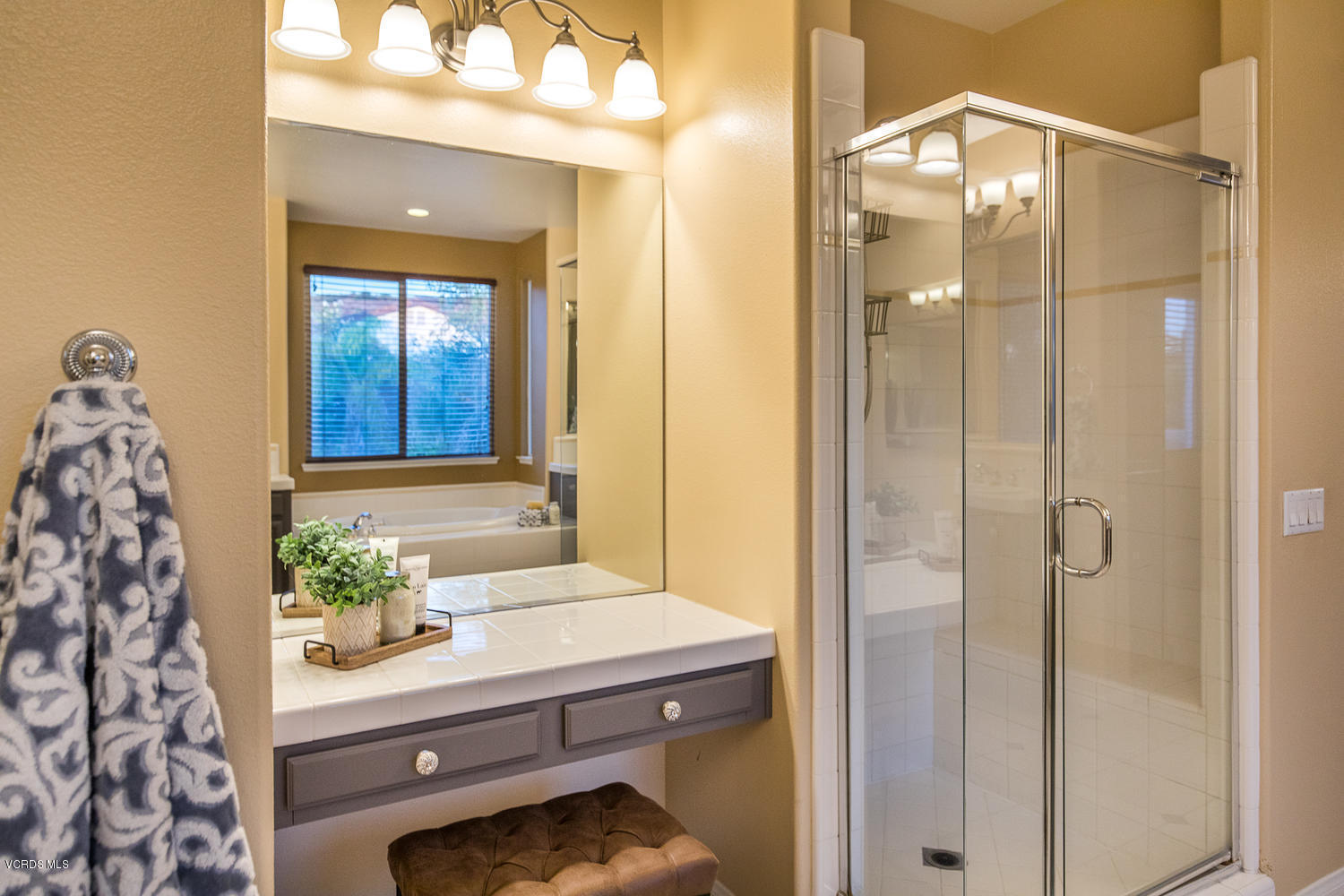 14410 Peach Hill Road Moorpark, CA 93021 - Photo 38 of 45 a bathroom with a sink and a mirror