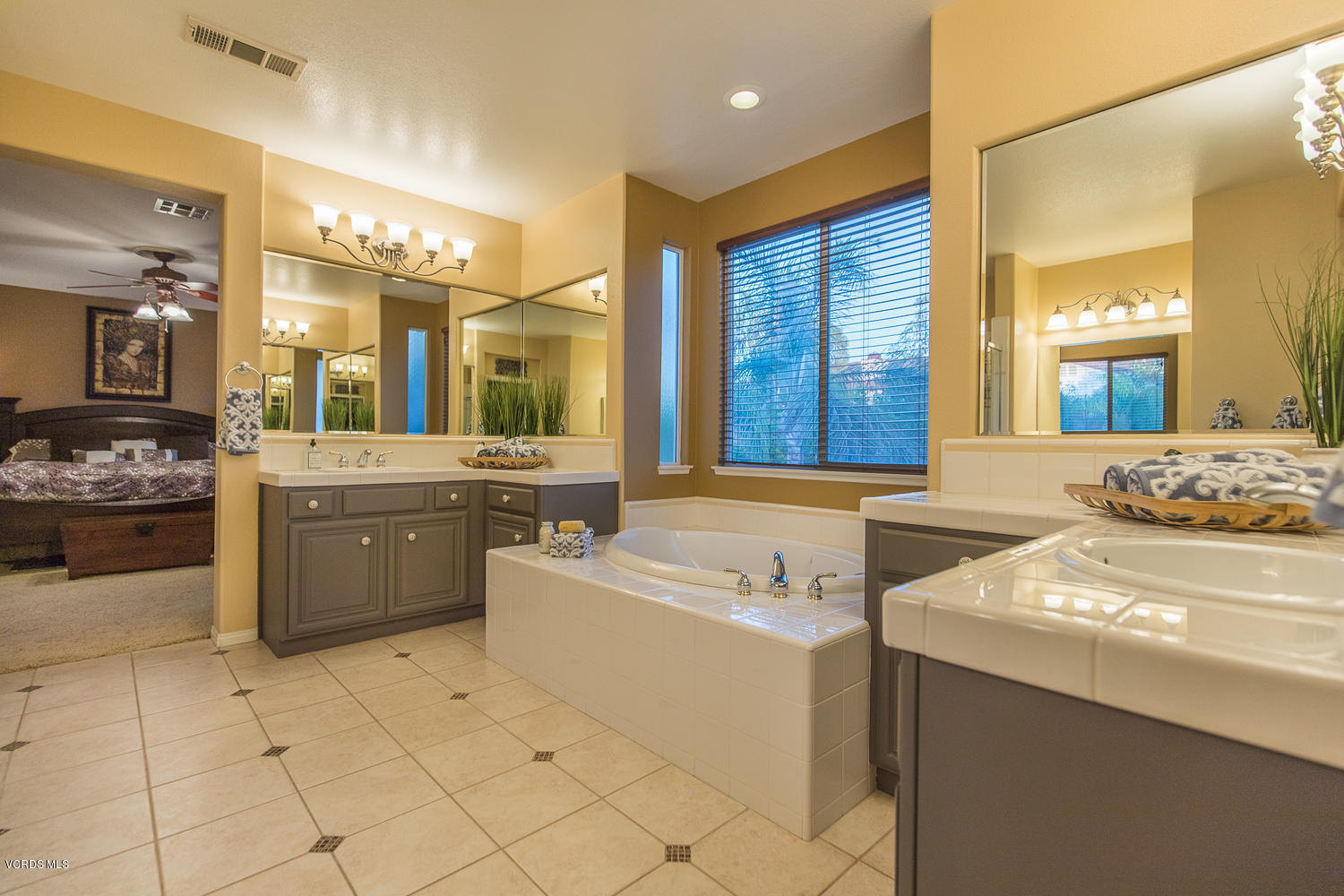 14410 Peach Hill Road Moorpark, CA 93021 - Photo 39 of 45 a large bathroom with a large tub sink shower and mirror