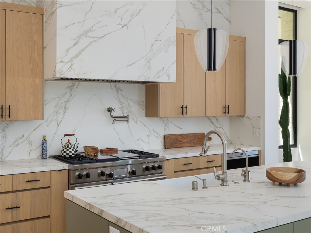 230 The Strand Hermosa Beach, CA 90254 - Photo 18 of 72 a kitchen with a stove and a sink
