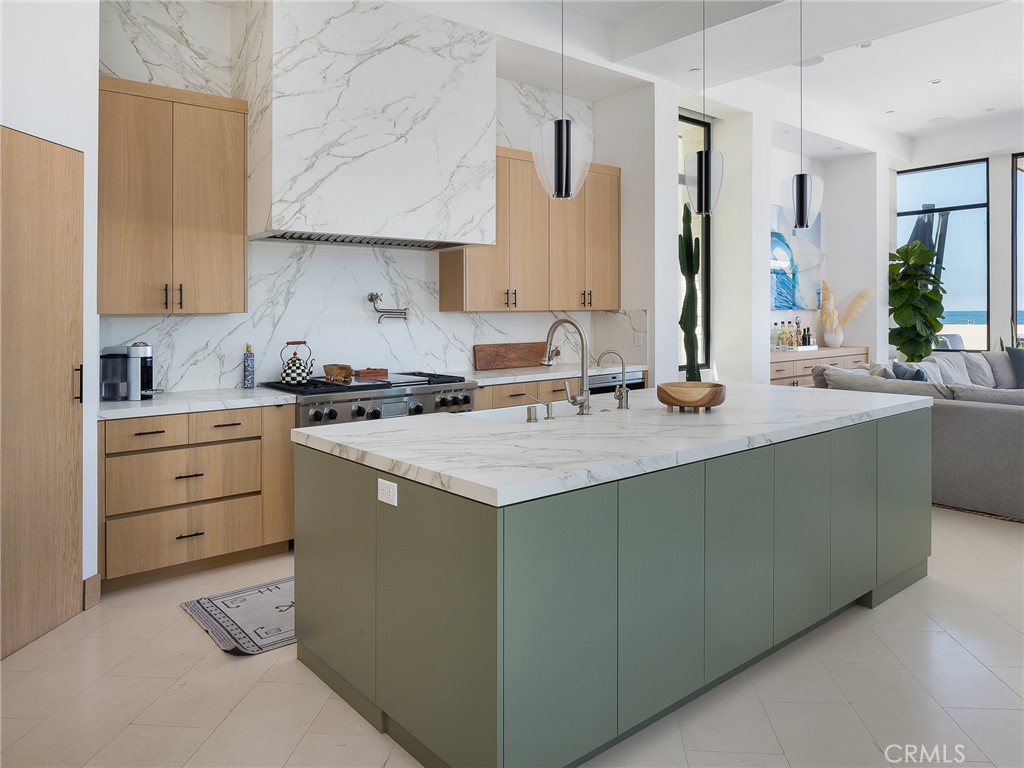 230 The Strand Hermosa Beach, CA 90254 - Photo 19 of 72 a kitchen with sink cabinets and stove