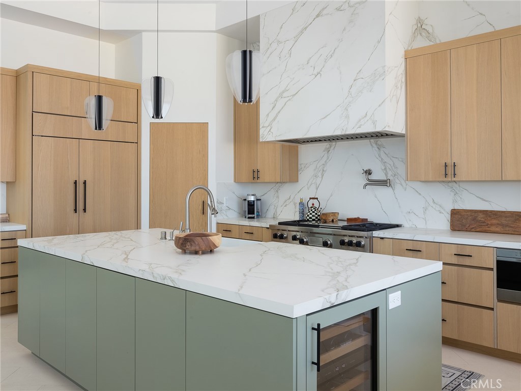 230 The Strand Hermosa Beach, CA 90254 - Photo 20 of 72 a kitchen with stainless steel appliances granite countertop a sink stove and refrigerator
