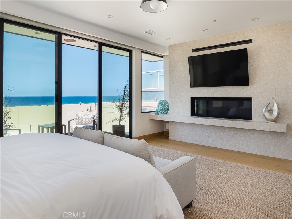 230 The Strand Hermosa Beach, CA 90254 - Photo 26 of 72 a bedroom with a bed and a television