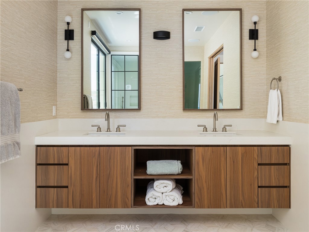 230 The Strand Hermosa Beach, CA 90254 - Photo 32 of 72 a bathroom with a sink and a mirror
