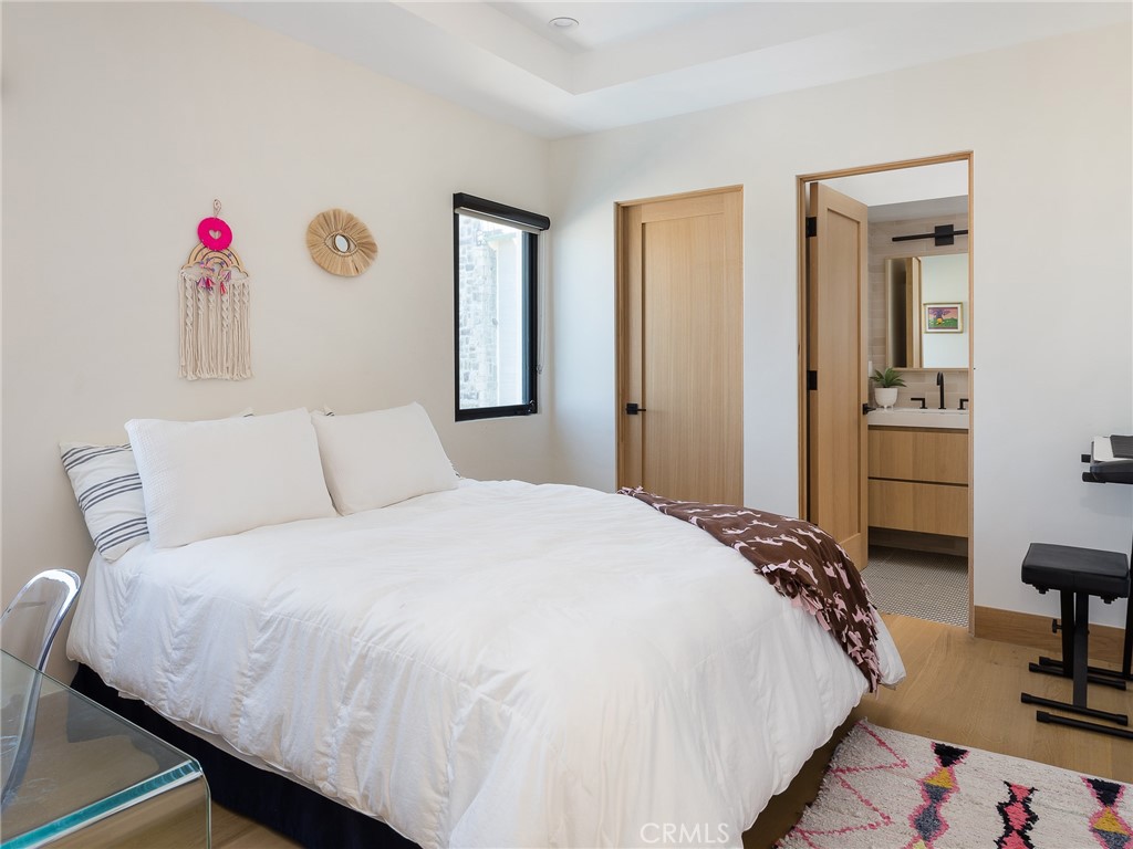 230 The Strand Hermosa Beach, CA 90254 - Photo 37 of 72 a bedroom with a bed and a closet