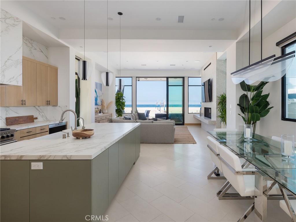 230 The Strand Hermosa Beach, CA 90254 - Photo 4 of 72 a large kitchen with a large window and stainless steel appliances