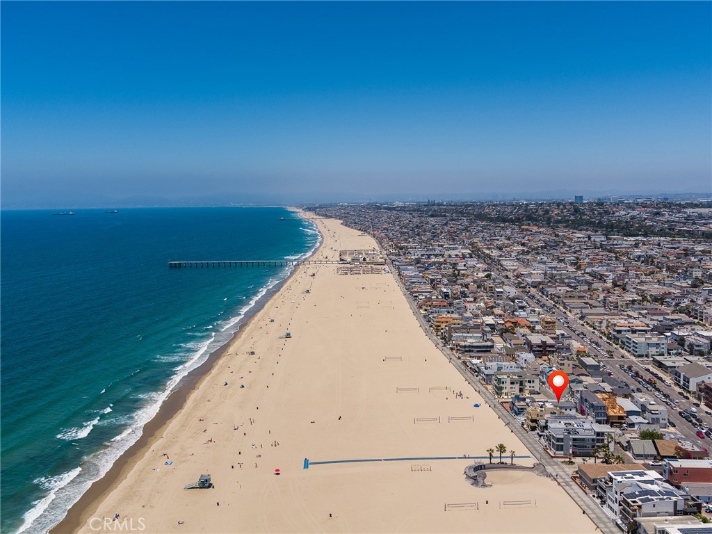 230 The Strand Hermosa Beach, CA 90254 - Photo 67 of 72 a view of a large body of water with a building in the background