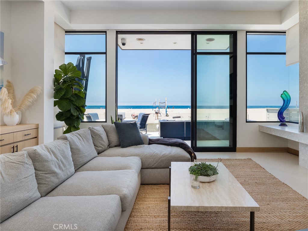 230 The Strand Hermosa Beach, CA 90254 - Photo 7 of 72 a living room with furniture and a potted plant