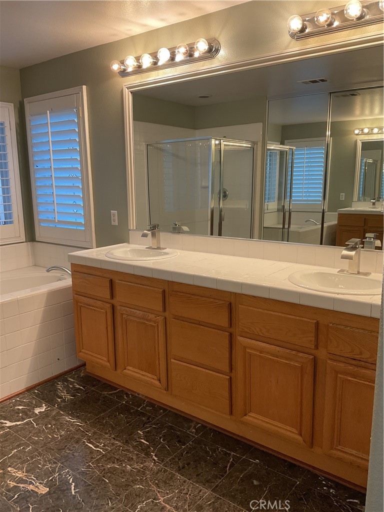 17636 Cypress Circle Carson, CA 90746 - Photo 16 of 29 a bathroom with a sink and a mirror