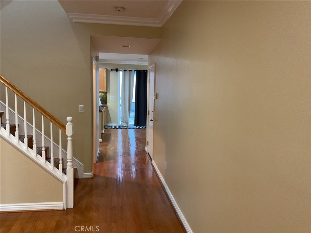 17636 Cypress Circle Carson, CA 90746 - Photo 3 of 29 a view of a hallway with wooden floor and staircase