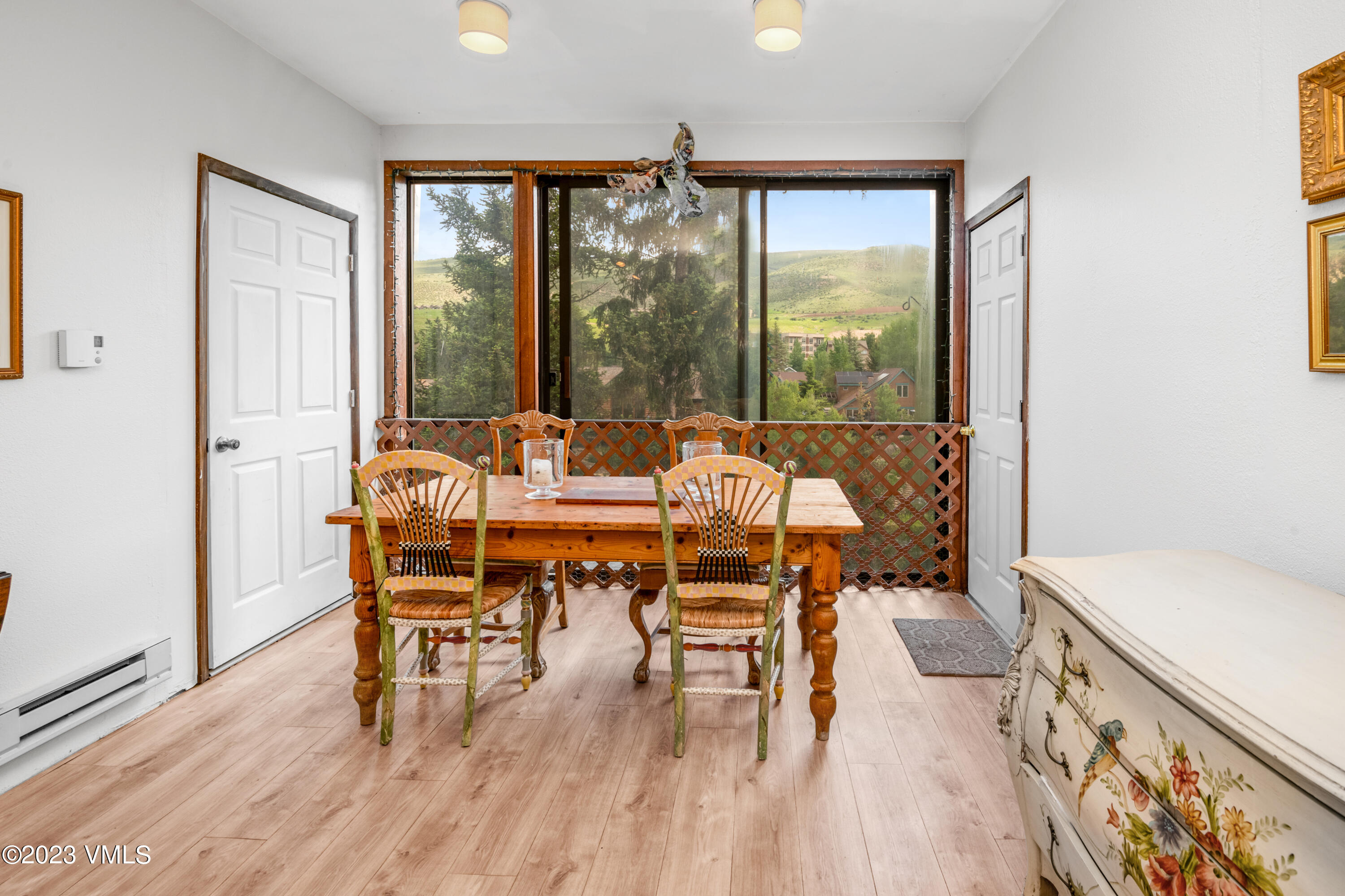 39377 Highway 6, Unit E205 Eagle Vail, CO 81620 - Photo 13 of 40 a dining room with furniture and wooden floor