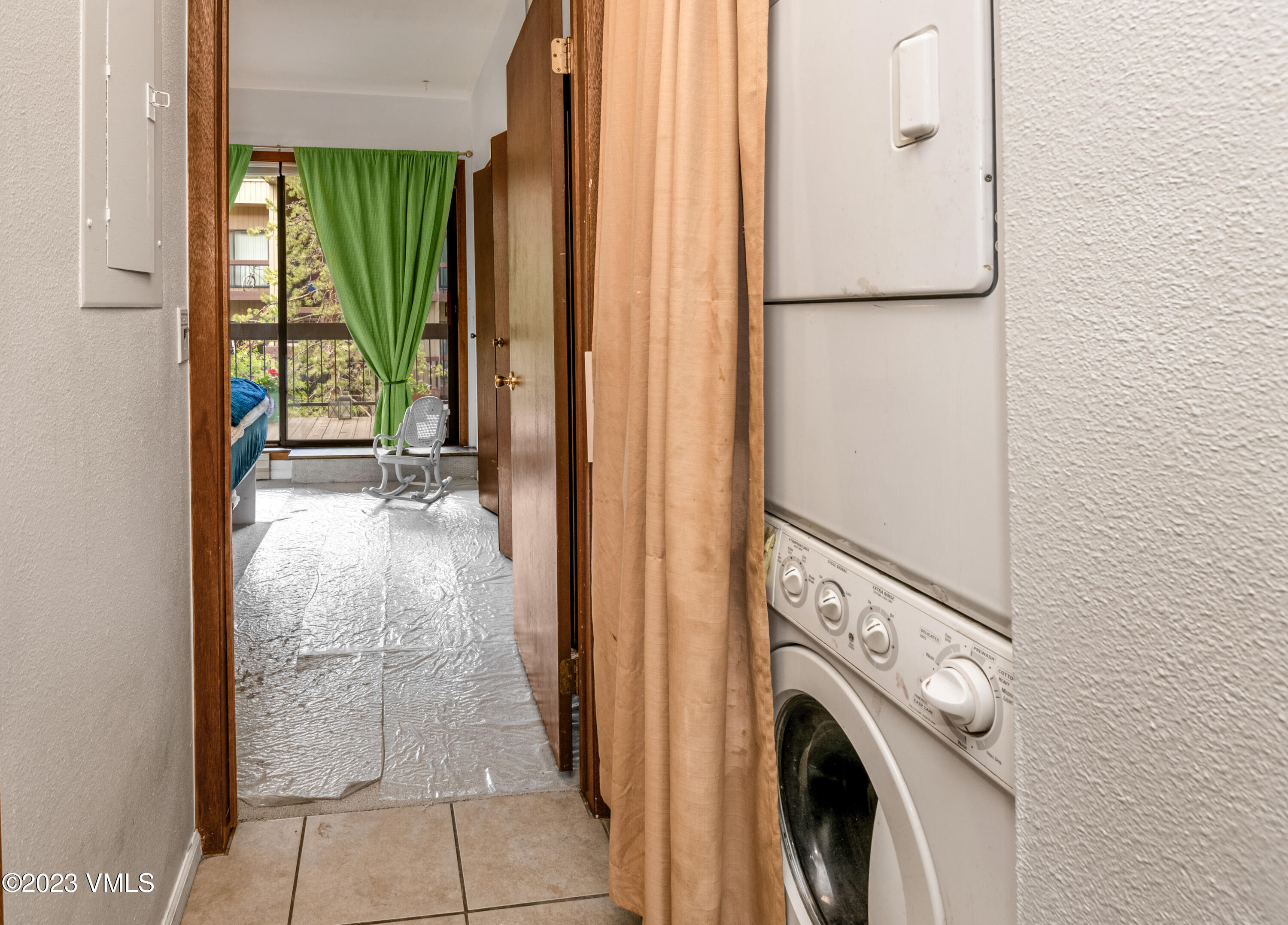 39377 Highway 6, Unit E205 Eagle Vail, CO 81620 - Photo 16 of 40 a view of a hallway with washer and dryer