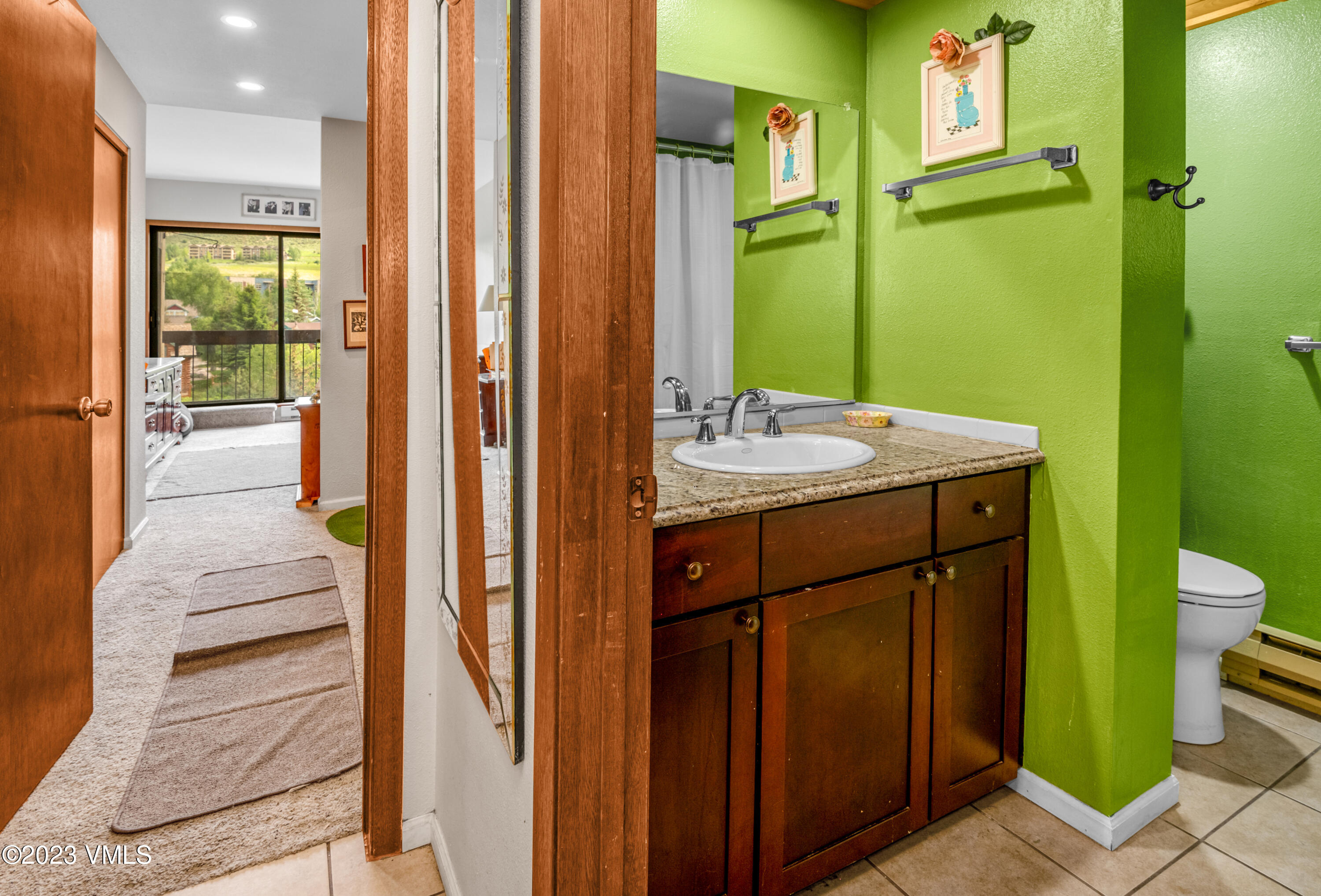 39377 Highway 6, Unit E205 Eagle Vail, CO 81620 - Photo 17 of 40 a bathroom with a sink a toilet and shower