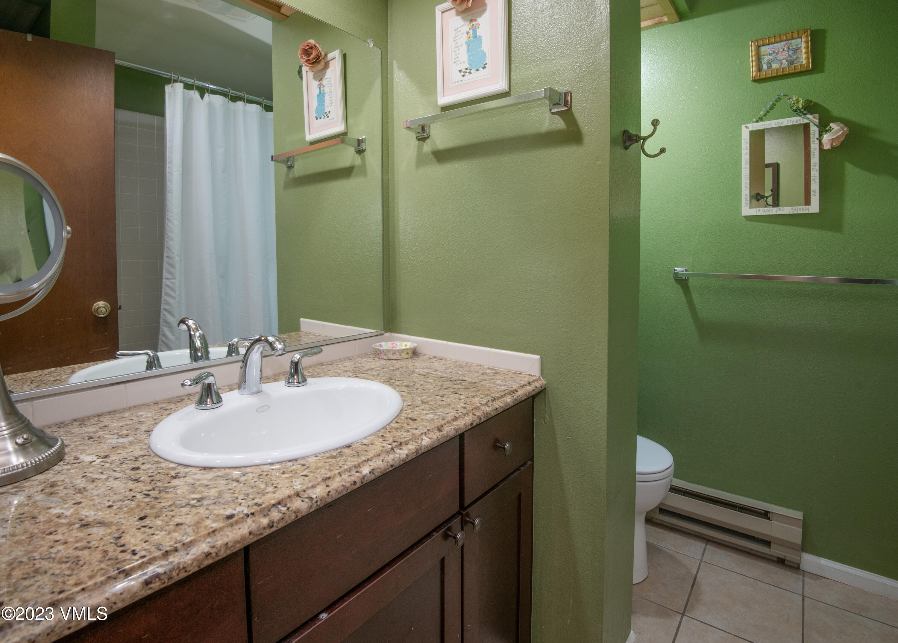39377 Highway 6, Unit E205 Eagle Vail, CO 81620 - Photo 18 of 40 a bathroom with a granite countertop sink and a mirror