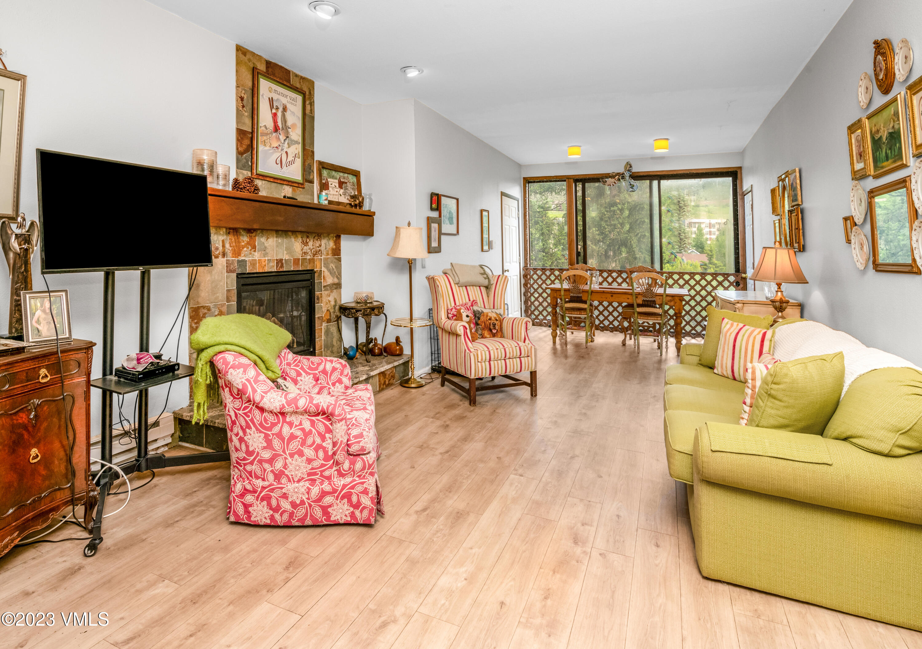 39377 Highway 6, Unit E205 Eagle Vail, CO 81620 - Photo 2 of 40 a living room with fireplace furniture and a flat screen tv