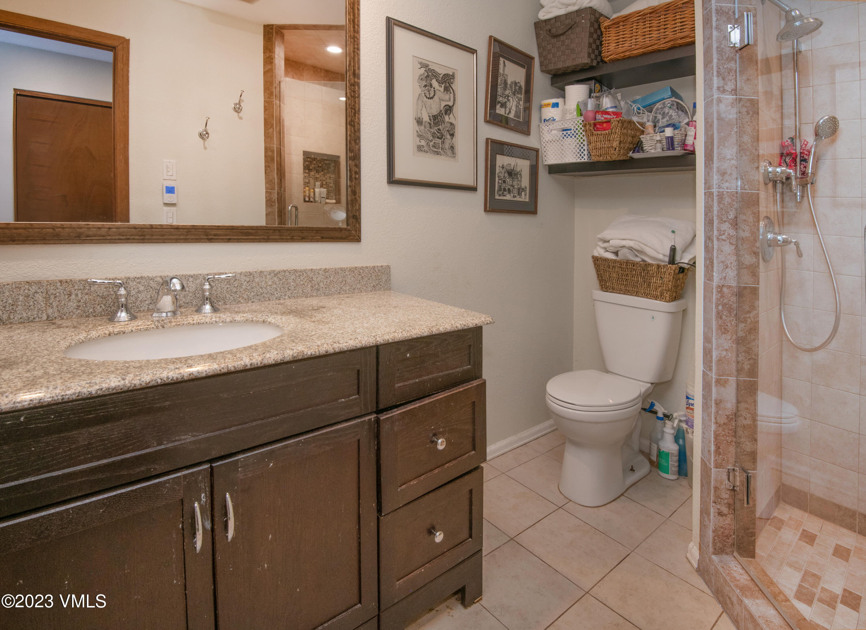 39377 Highway 6, Unit E205 Eagle Vail, CO 81620 - Photo 22 of 40 a bathroom with a sink a toilet and a mirror