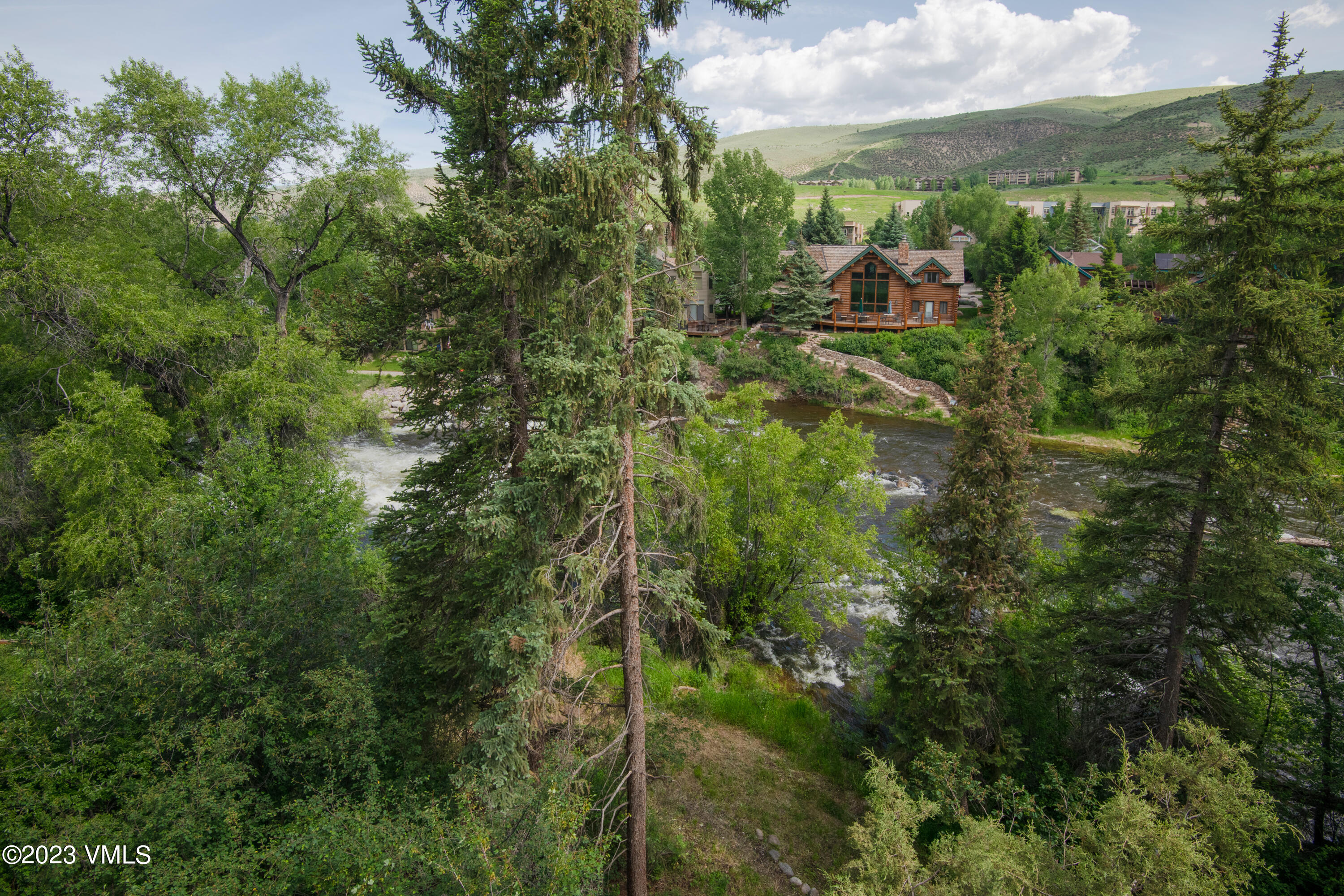 39377 Highway 6, Unit E205 Eagle Vail, CO 81620 - Photo 28 of 40 a view of a forest with a street