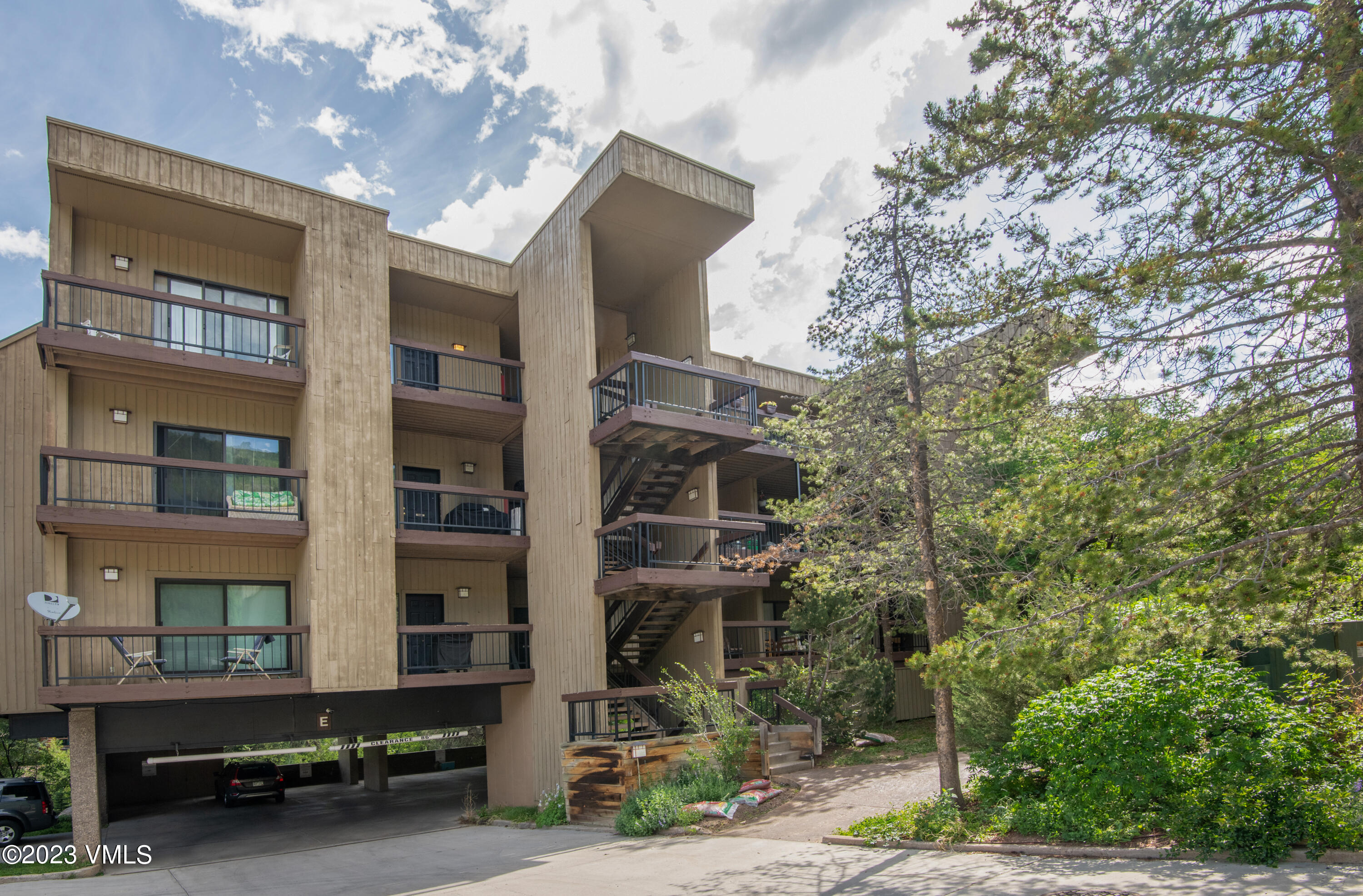 39377 Highway 6, Unit E205 Eagle Vail, CO 81620 - Photo 3 of 40 a front view of a house with a yard