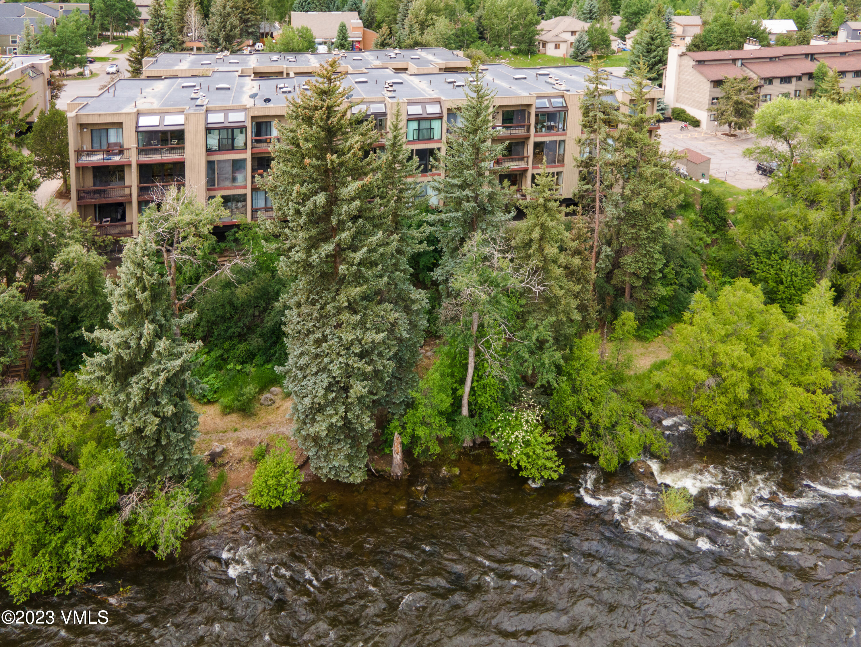 39377 Highway 6, Unit E205 Eagle Vail, CO 81620 - Photo 35 of 40 a view of a house with a yard and sitting area