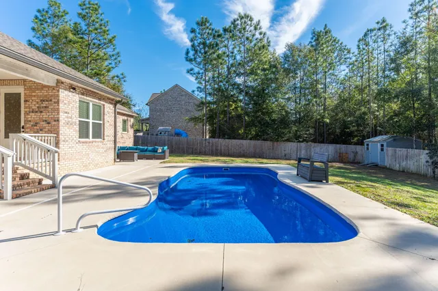 a view of a swimming pool with a chairs