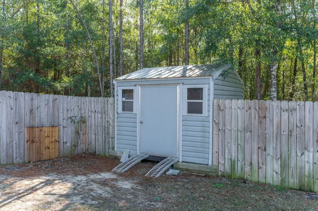 a front view of a house with a yard table and chairs