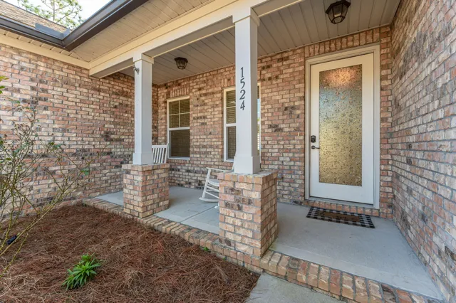 a front view of a house with outdoor seating