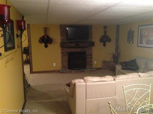 7527 Frith Road Columbus, MI 48063 - Photo 16 of 17 7527 Frith Road - finished basement fireplace.jpg