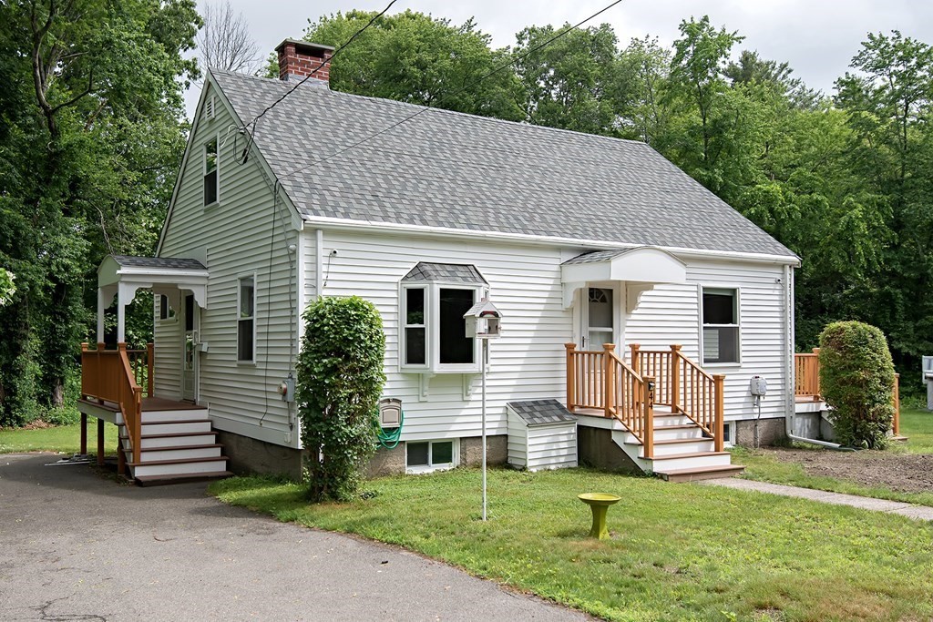 44 Charlotte Road Walpole, MA 02032 - Photo 1 of 25 a view of a house with a yard