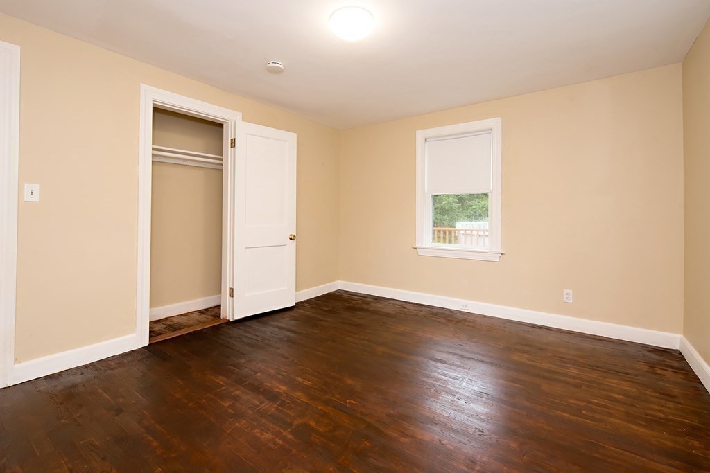 44 Charlotte Road Walpole, MA 02032 - Photo 11 of 25 an empty room with wooden floor and windows