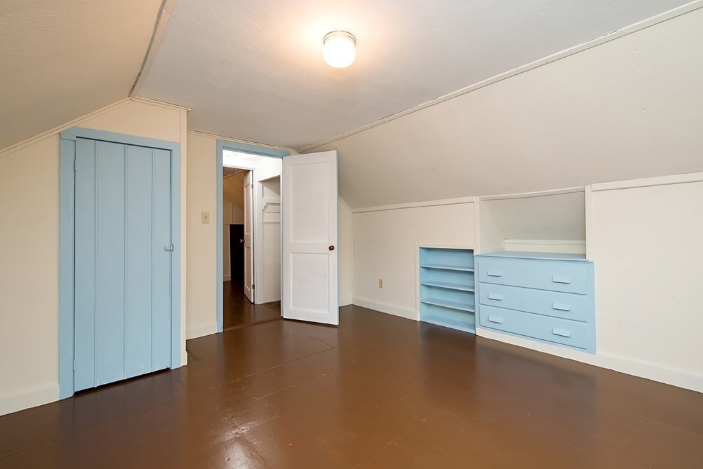 44 Charlotte Road Walpole, MA 02032 - Photo 15 of 25 an empty room with cabinet and wooden floor