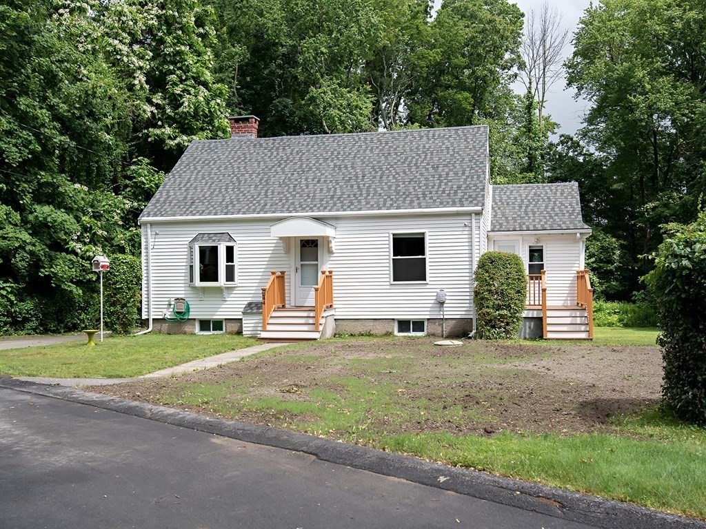 44 Charlotte Road Walpole, MA 02032 - Photo 2 of 25 a view of a house with a yard and fence