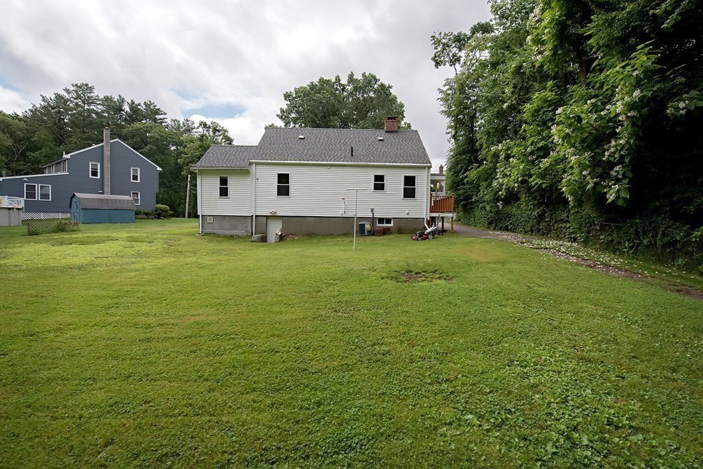44 Charlotte Road Walpole, MA 02032 - Photo 25 of 25 a view of a house with a yard and sitting area