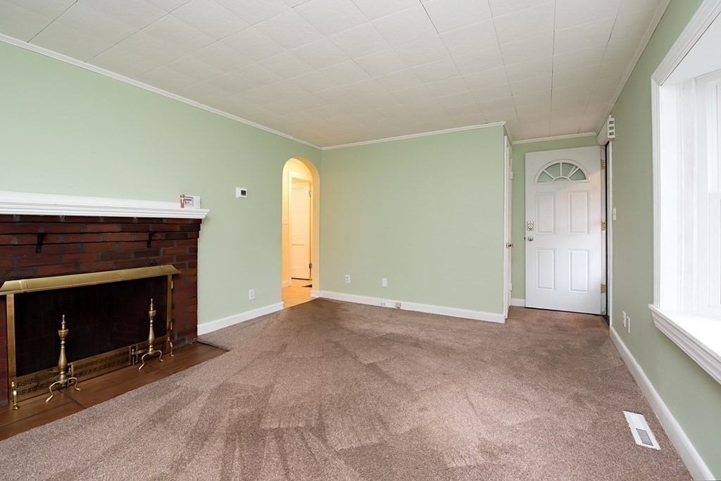 44 Charlotte Road Walpole, MA 02032 - Photo 5 of 25 a view of empty room with a fireplace