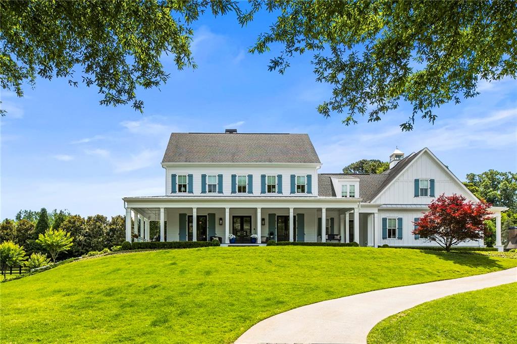 13985 Haystack Lane Milton, GA 30004 - Photo 1 of 1 a front view of a house with a garden