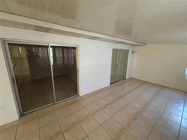 an empty room with wooden floor