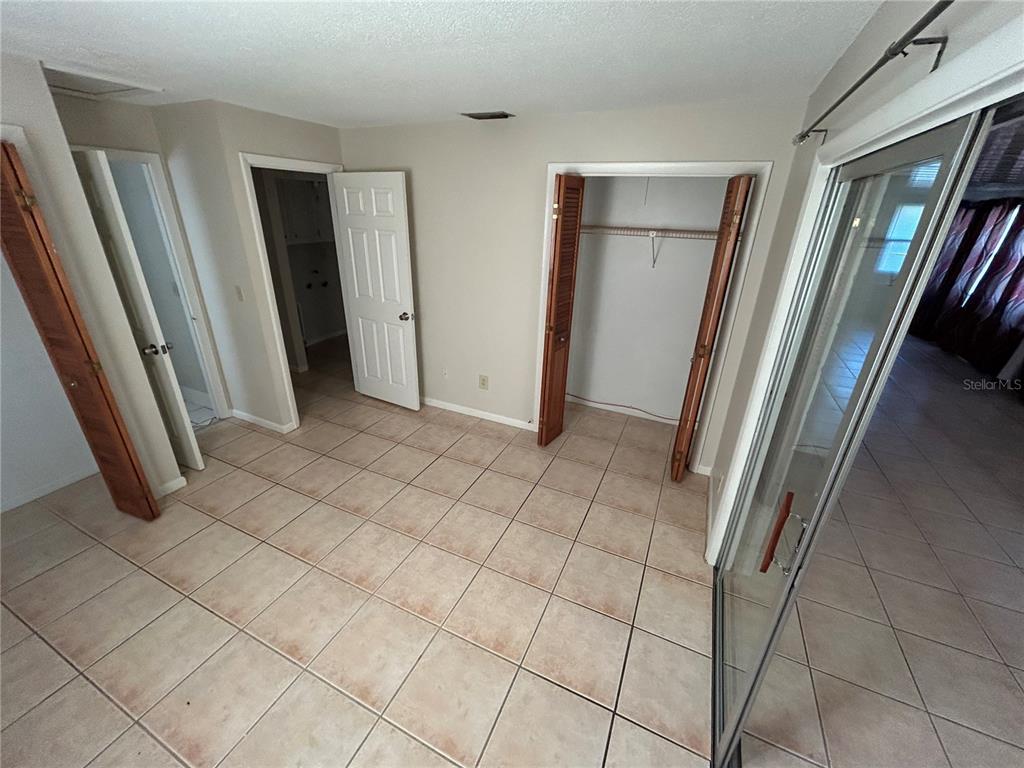 21696 Southwest Raintree Street Dunnellon, FL 34431 - Photo 19 of 35 a view of a refrigerator and an empty room